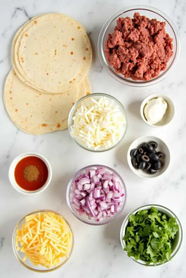 Layered Mexican pizza with ground beef, beans, and melted cheese on crispy tortillas
