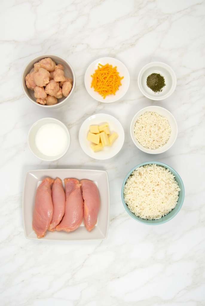 A creamy slow cooker crack chicken and rice casserole with melted cheese on top