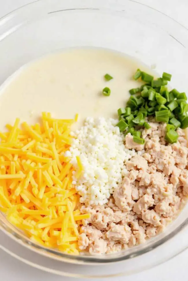 A creamy slow cooker crack chicken and rice casserole with melted cheese on top