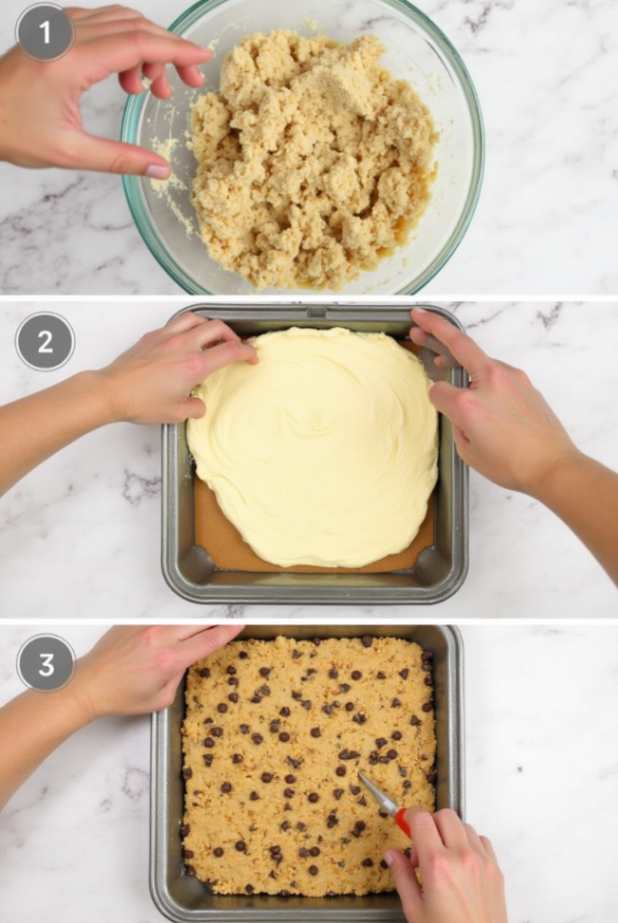 A stack of Brown Butter Chocolate Chip Cookie Cheesecake Bars on a marble table, showing creamy cheesecake and golden cookie layers.