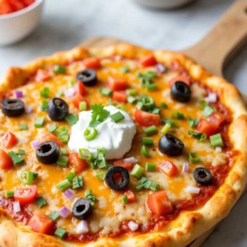 Layered Mexican pizza with ground beef, beans, and melted cheese on crispy tortillas