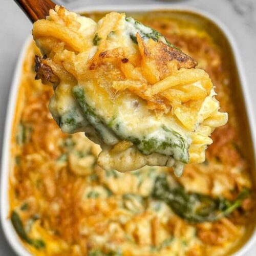 Baked Monterey Chicken One Pan Orzo topped with melted cheese and crispy onions in a white casserole dish