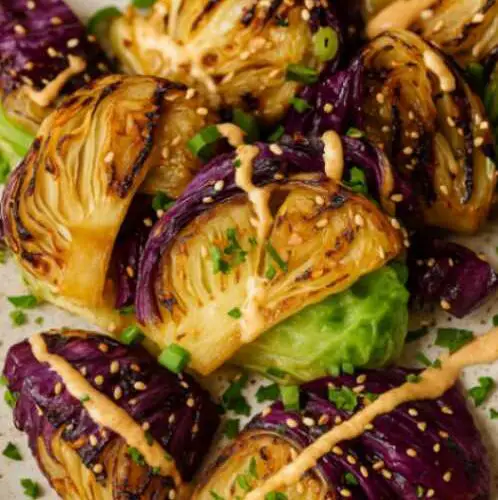 Bowl of Sweet Restaurant Slaw on a white marble table, with creamy dressing and fresh shredded cabbage