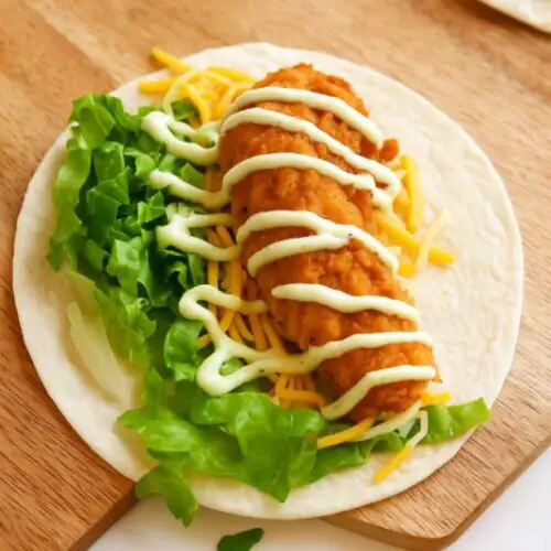 McDonald’s Snack Wrap with crispy chicken tender, shredded lettuce, cheddar cheese, and ranch sauce on a flour tortilla